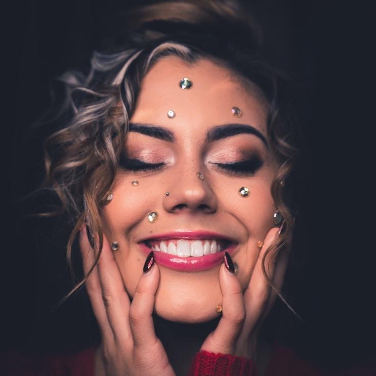 Maya Arora, Lead Design Strategist at OakArtJoy, reviewing corporate floral arrangements